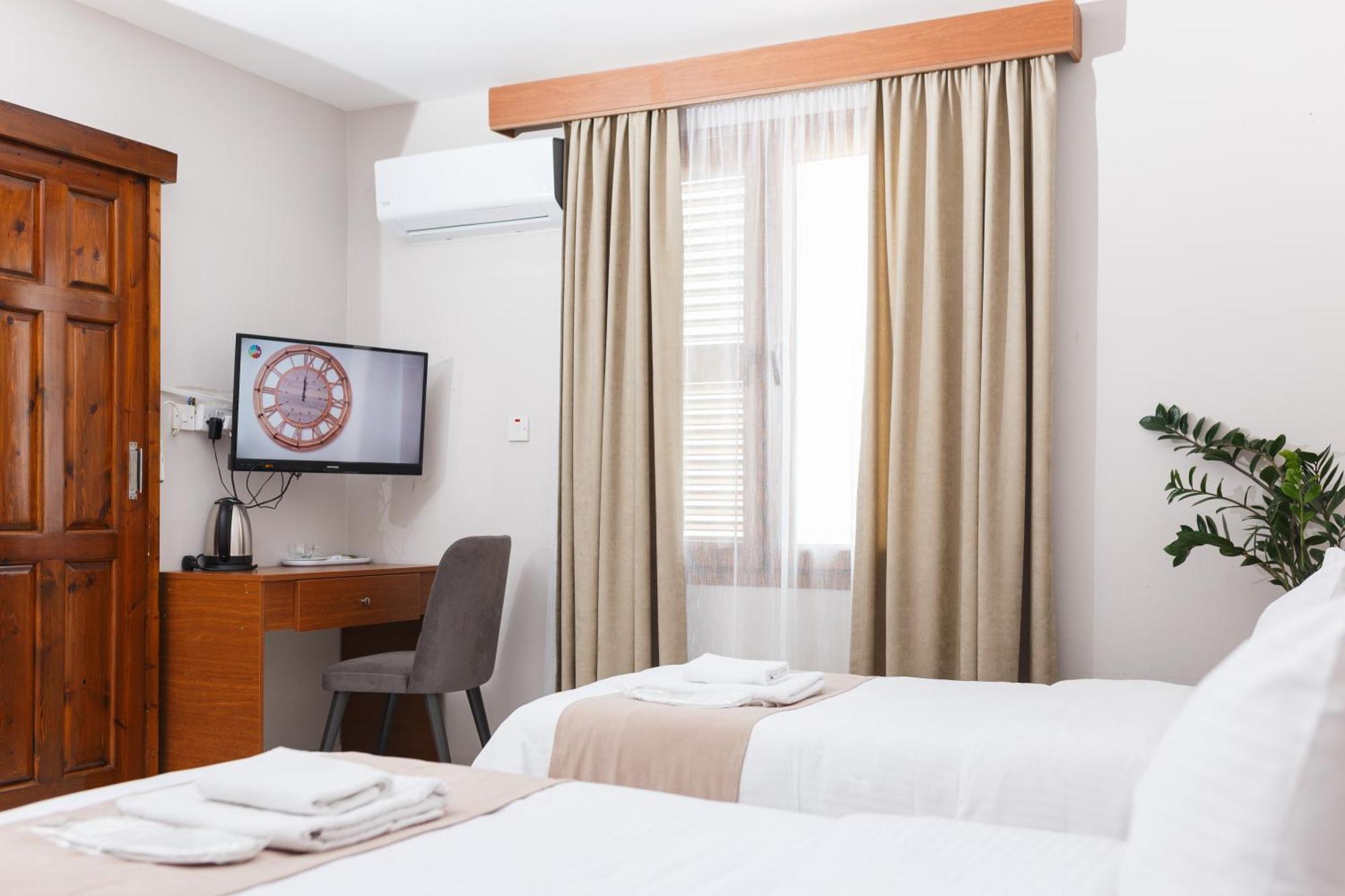 Homelike Guest House Cirénia Quarto foto